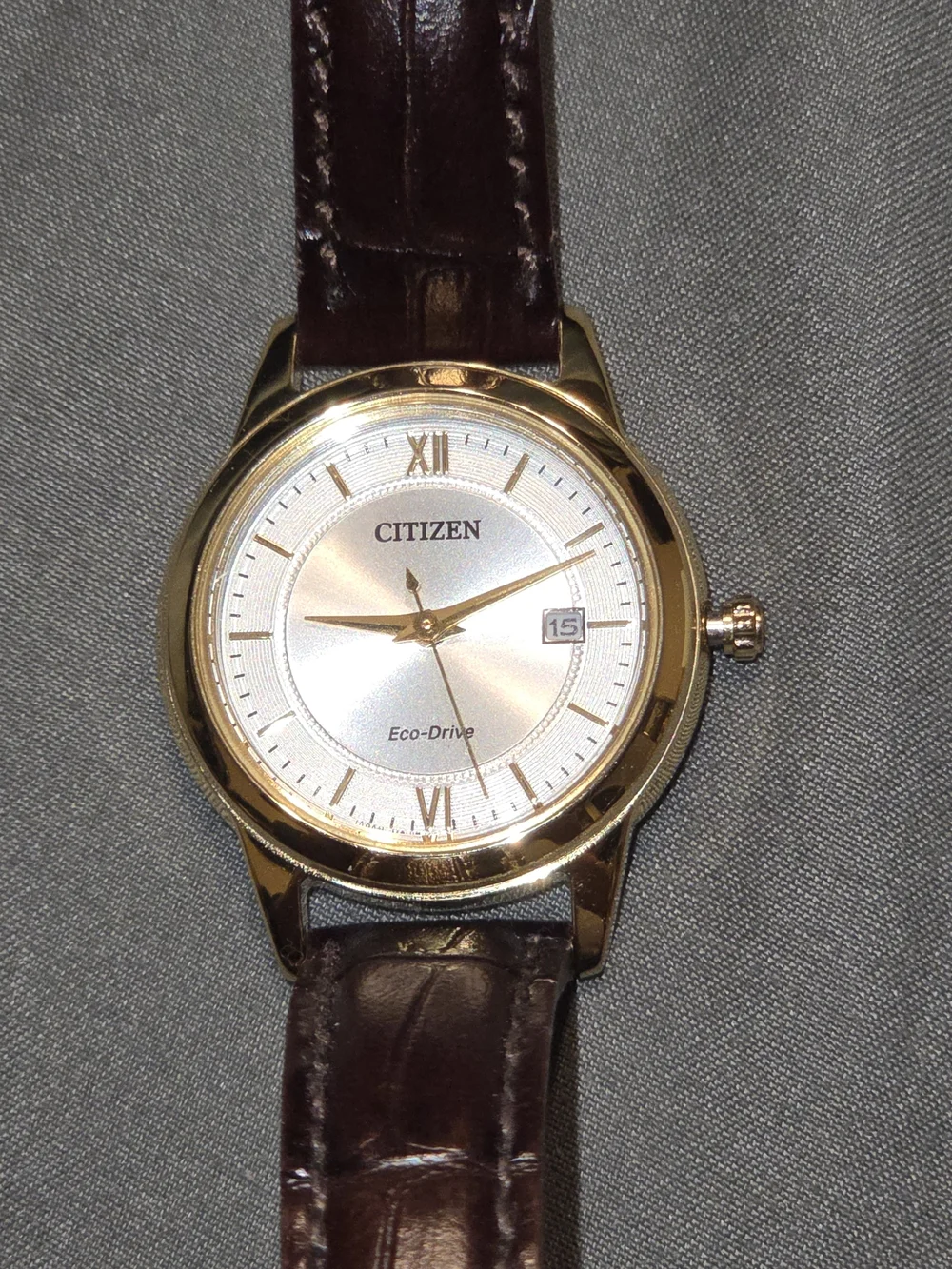 Citizen Gold Tone Case Watch with Brown Strap.